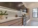 Stylish kitchen featuring stainless steel appliances, modern cabinetry, and quartz countertops at 191 Darwish Dr, Mcdonough, GA 30252