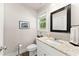 Bathroom with a white vanity, granite counters, and a framed mirror at 2850 Winchester Dr, Cumming, GA 30041