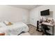Bedroom with a desk, a bed, wood floors, and natural lighting at 2850 Winchester Dr, Cumming, GA 30041
