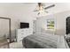 Comfortable bedroom featuring natural light, ceiling fan, large dresser and soothing color palette creating a tranquil space at 2850 Winchester Dr, Cumming, GA 30041