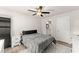 Cozy bedroom features neutral walls, ceiling fan, and access to the bathroom; decorated for comfort and relaxation at 2850 Winchester Dr, Cumming, GA 30041