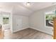 Bright bedroom with two windows, wood floors, and attic access at 2850 Winchester Dr, Cumming, GA 30041
