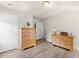 Brightly lit bedroom with wood floors and paneled doors at 2850 Winchester Dr, Cumming, GA 30041