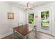 Cozy dining area with a backyard view, a modern light fixture, and easy access to the outdoor space at 2850 Winchester Dr, Cumming, GA 30041