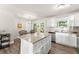 Well-lit kitchen with granite countertops, stainless appliances, and ample cabinetry, with a door to the back patio at 2850 Winchester Dr, Cumming, GA 30041