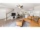 Spacious living area with hardwood floors, fireplace, and a seamless flow into the kitchen with bright light at 2850 Winchester Dr, Cumming, GA 30041