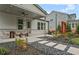 Backyard patio with fire pit, dining area, landscaping, and outdoor lighting at 4770 Wayt Farm Overlook, Cumming, GA 30040