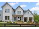 Charming two-story home with gray siding, black windows, and landscaped front yard at 4770 Wayt Farm Overlook, Cumming, GA 30040