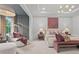 Spacious bedroom with stylish seating area, large windows, and a comfortable bed, creating a perfect relaxation space at 4770 Wayt Farm Overlook, Cumming, GA 30040