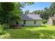 Private backyard with lush greenery and shade trees perfect for outdoor enjoyment at 5426 Martins Crossing Rd, Stone Mountain, GA 30088