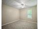 Bedroom with carpet flooring, a neutral color palette, and a window at 5426 Martins Crossing Rd, Stone Mountain, GA 30088