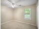 Carpeted bedroom with window and ample natural light at 5426 Martins Crossing Rd, Stone Mountain, GA 30088