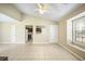Open-concept living space with tile floors, a fireplace, and a pass through to the kitchen at 5426 Martins Crossing Rd, Stone Mountain, GA 30088