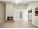 Open-concept living room featuring a fireplace and tile flooring at 5426 Martins Crossing Rd, Stone Mountain, GA 30088