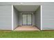 Covered patio with sliding glass doors provides private outdoor living at 5426 Martins Crossing Rd, Stone Mountain, GA 30088