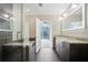 Modern bathroom features double sinks and granite counters, glass shower and walk-in closet at 1080 Peachtree Ne St # 804, Atlanta, GA 30309
