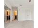 Bright bedroom featuring neutral carpet, double doors and large mirrored closet at 1080 Peachtree Ne St # 804, Atlanta, GA 30309
