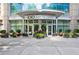 Upscale building entrance with modern architecture and professional landscaping at 1010 Midtown at 1080 Peachtree Ne St # 804, Atlanta, GA 30309