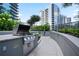 Community outdoor kitchen with stainless steel grill and countertop at 1080 Peachtree Ne St # 804, Atlanta, GA 30309