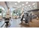 Bright gym with exercise machines, free weights, and expansive windows overlooking the city at 1080 Peachtree Ne St # 804, Atlanta, GA 30309