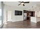Open concept living space with sleek hardwood floors, ceiling fan, and access to a modern kitchen at 1080 Peachtree Ne St # 804, Atlanta, GA 30309