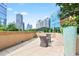 Outdoor patio with comfortable seating, landscaping, and stunning city views at 1080 Peachtree Ne St # 804, Atlanta, GA 30309