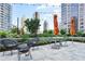 Outdoor patio with comfortable seating, garden with lush landscaping, and city views at 1080 Peachtree Ne St # 804, Atlanta, GA 30309