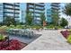 Large outdoor patio with dining area, comfortable seating, lush landscaping, and city views at 1080 Peachtree Ne St # 804, Atlanta, GA 30309