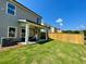 Well-maintained backyard with lush green lawn and a covered patio, ideal for outdoor living and entertaining at 120 Winsome Way, Woodstock, GA 30188