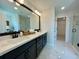 Bathroom with double sinks, large mirror, and sleek cabinets at 120 Winsome Way, Woodstock, GA 30188