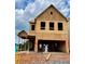 New home under construction with visible framing, siding, and windows in a residential area at 120 Winsome Way, Woodstock, GA 30188