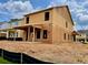 New home under construction with visible framing, siding and windows, on a neatly graded lot at 120 Winsome Way, Woodstock, GA 30188