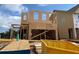 Construction site view showing the wood frame of a new two-story home being constructed in a residential area at 120 Winsome Way, Woodstock, GA 30188