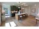 Modern kitchen with stainless steel appliances, a center island with seating, and beautiful pendant lighting at 120 Winsome Way, Woodstock, GA 30188