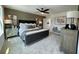 Beautifully staged bedroom with a modern ceiling fan and decorative side tables and complementary furniture at 120 Winsome Way, Woodstock, GA 30188