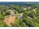 Aerial perspective of the home nestled among a lush green landscape at 4292 Sardis Church Rd, Buford, GA 30519