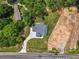 Birds-eye view of home situated among trees, showcasing driveway, and landscaped yard at 4292 Sardis Church Rd, Buford, GA 30519