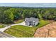Aerial view of the home featuring a long driveway and lush surroundings at 4292 Sardis Church Rd, Buford, GA 30519