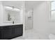 Contemporary bathroom with marble-look tiling, glass shower, and sleek vanity with undermount sink at 4292 Sardis Church Rd, Buford, GA 30519