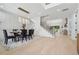 Open concept dining area with stylish lighting, modern decor, and seamless flow to other spaces at 4292 Sardis Church Rd, Buford, GA 30519