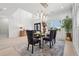 Bright dining room featuring stylish chandelier, modern decor, and elegant finishes at 4292 Sardis Church Rd, Buford, GA 30519