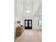 Elegant foyer featuring a grand two-story entrance with a chandelier and light wood floors at 4292 Sardis Church Rd, Buford, GA 30519