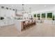 Spacious kitchen featuring a large island with seating and natural light from large windows at 4292 Sardis Church Rd, Buford, GA 30519