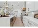 Modern kitchen with white countertops, stainless steel appliances, and custom cabinetry at 4292 Sardis Church Rd, Buford, GA 30519