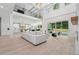 Bright, open-concept living space with soaring ceilings, modern finishes, and seamless indoor-outdoor flow at 4292 Sardis Church Rd, Buford, GA 30519