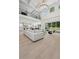 Open-concept living area with soaring ceilings, modern decor, and seamless access to the backyard at 4292 Sardis Church Rd, Buford, GA 30519