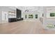 Open concept living room with gas fireplace and hardwood flooring at 4292 Sardis Church Rd, Buford, GA 30519