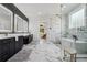 Bathroom featuring marble floors, quartz countertops, soaking tub, and walk-in shower at 4292 Sardis Church Rd, Buford, GA 30519
