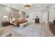 Spacious main bedroom with large area rug and decoratively painted walls at 4292 Sardis Church Rd, Buford, GA 30519
