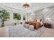 Main bedroom with accent wall, tray ceiling, and plenty of natural light at 4292 Sardis Church Rd, Buford, GA 30519